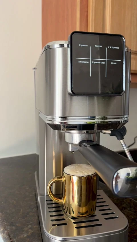 Freshly brewed coffee droplets falling into cup from a coffee machine Stock Footage 342062416