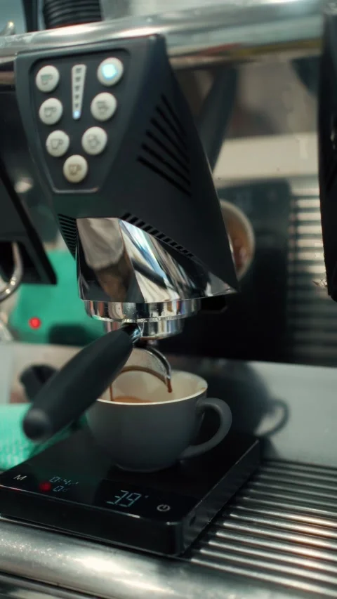 Freshly Brewed Espresso Flowing into a Cup Видео 346119509
