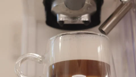 Freshly Brewed Latte from Coffee Machine with Portafilter and Milk Frother. Stock Footage 346187627