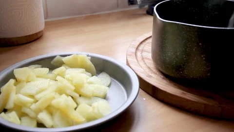 Freshly Cooked Apple being served into A Dish Stock Footage 134576406
