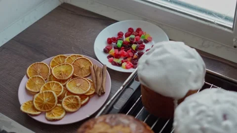 Freshly cooked Homemade traditional Easter Cakes covered in white Glaze Stock Footage 236904529