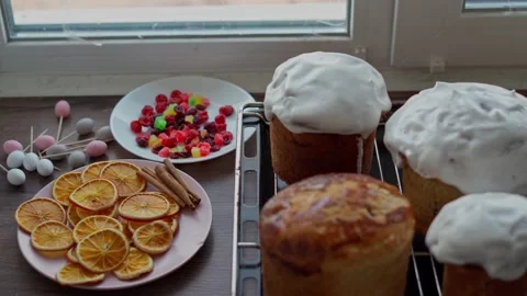 Freshly cooked Homemade traditional Easter Cakes covered in white Glaze Stock Footage 236904532