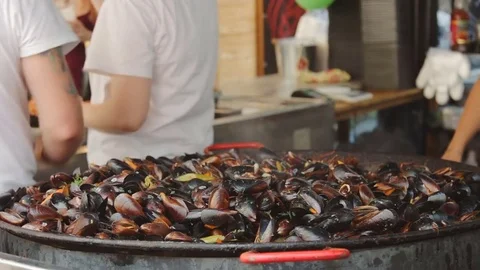 Freshly cooked mussels in cauldron. Stock Footage 79284979