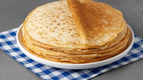 Freshly cooked pancakes on a grey table. High quality 4k footage Stock Footage 328195717