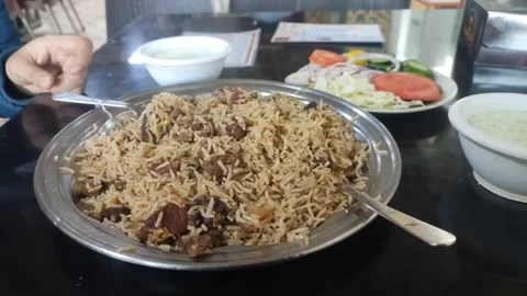 Freshly cooked rice dish called Pulao full of mutton 動画素材 232044784