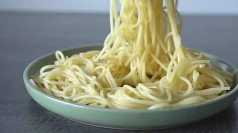 Freshly cooked spaghetti. Close-up of spaghetti in a plate. Stock Footage 306283227