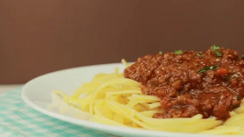 Freshly cooked spaghetti covered with tomato sauce, rotating Stock-Footage 73968725