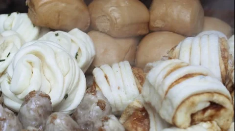 Freshly cooked steamed buns and dumplings for sale in a small restaurant Stock Footage 63948854