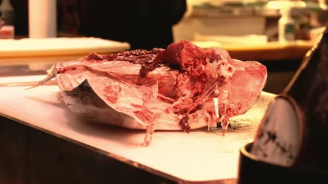 Freshly cut cross section of tuna fish on wooden table Stock Footage 227471992