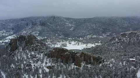 Freshly fallen snow blankets the surroundings of Cheley Camps Colorado Stock Footage 247364168