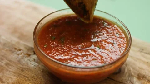 Freshly fried hot beef quesadilla soaked in salsa. Process of making mexican Stock Footage 151296106