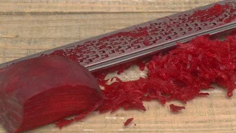 Freshly Grated Beetroot on a Rustic Wooden Surface for Culinary Preparation and Stockbeeldmateriaal 280693369