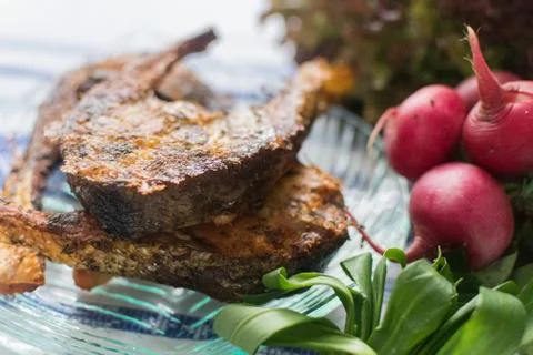 Freshly grilled fish on kitchen table. closeup, top view. Foto stock