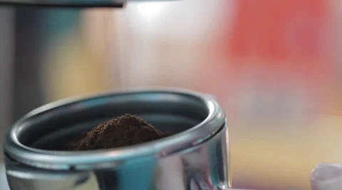 Freshly ground coffee from the coffee machine Видео 58861559