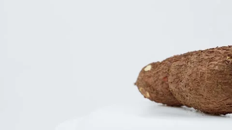 Freshly Harvested Cassava Root Rotating on White Background Stock Footage 324914037