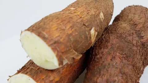 Freshly Harvested Cassava Root Rotating on White Background Stock Footage 324914042