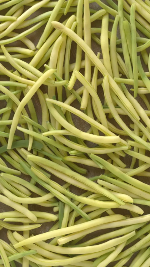 Freshly harvested yellow string beans texture background. Vertical video. Stock Footage 280107577