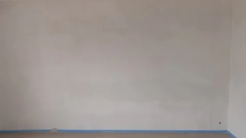 Freshly installed drywall with white primer on the wall Stock Footage 345449606