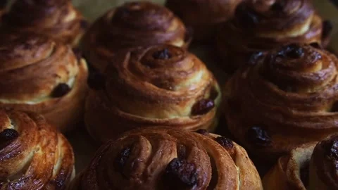Freshly made buns. The concept of making delicious baked goods at home. Stock Footage 169404911
