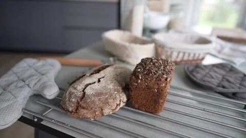 Freshly made homemade bread on the kitchen table Stock Footage 329432844