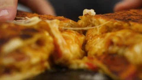 Freshly made hot appetizing peperoni pizza with melted cheese on a wooden table Stock Footage 106848338