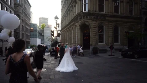 Freshly Married Couple Walking in Old Montreal Area close to Notre-Dame Basilica Stock Footage 80471601