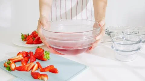 Freshly mixed strawberry jelly solution ready for pouring. Stock Photos