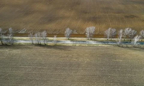 Freshly plowed fields top view from the drone. Agriculture and farming Stock Photos