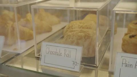 Freshly prepared bakery on the display shelf for customers to look appetizing. Stock Footage 240462133