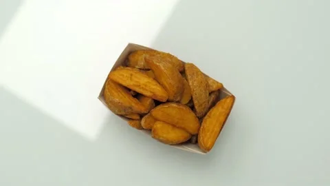 Freshly prepared fried potatoes in a package ready for consumption Video stock 147029205