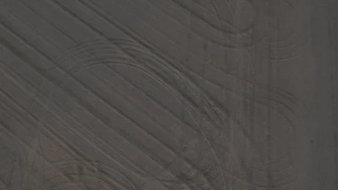 Freshly prepared seedbed with tractor tire patterns across Po Valley farmland Stock Footage 340604045