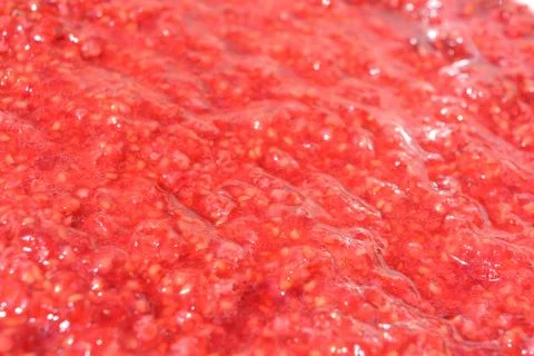 Freshly ripened with fork, fresh raspberry, raspberry porridge, natural mass. Stock Photos