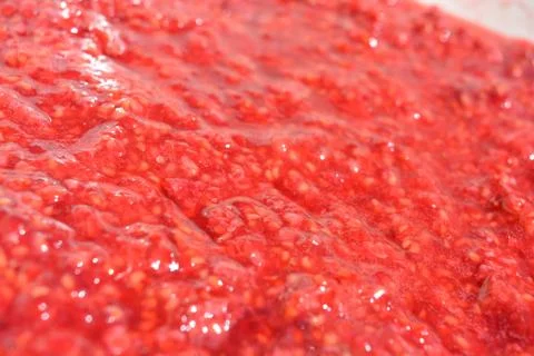 Freshly ripened with fork, fresh raspberry, raspberry porridge, natural mass. Stock Photos