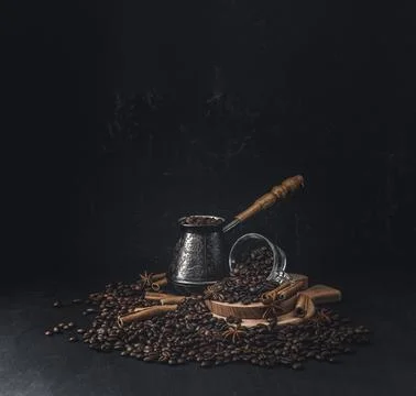 Freshly roasted coffee beans. A bundle of coffee beans on a dark background.. Stock Photos
