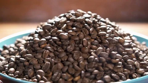 Freshly roasted coffee beans in ceramic plate. Stock Footage 84036335