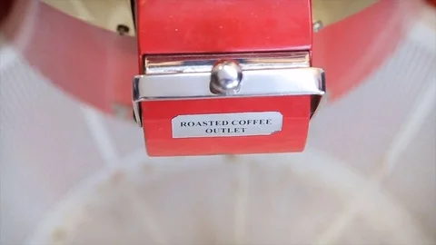 The freshly roasted coffee beans from coffee roaster. Coffee beans after Stock Footage 76346814