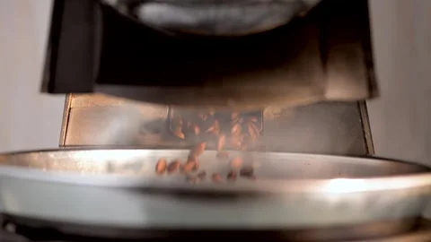 Freshly Roasted Coffee Beans Ejected into Cooling Tray, Slow Motion Stock Footage 247660795