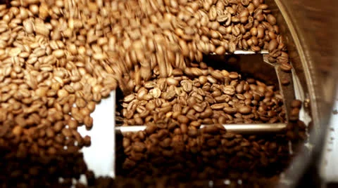 Freshly roasted Coffee beans - Entering chute Stock Footage 26319186