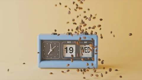 Freshly roasted coffee beans fall on a retro clock with date. Stock Footage 129635541