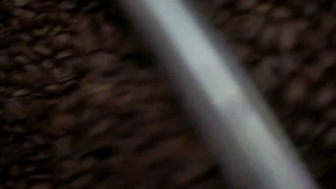 Freshly roasted coffee beans falling into a spinning cooler Stock Footage 81062260