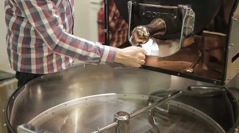 The freshly roasted coffee beans from a large coffee roaster Stock Footage 43483197