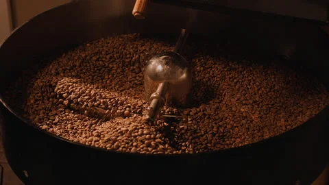 Freshly roasted coffee beans from a large coffee roaster in mixing cooling Stock Footage 246762649