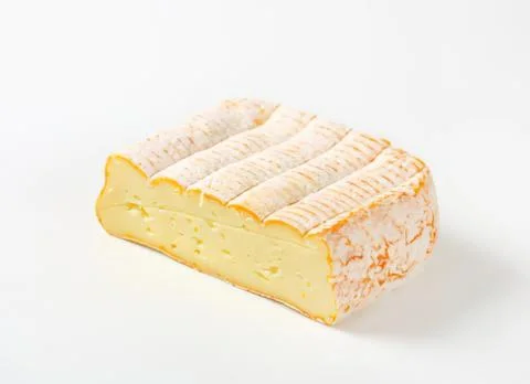 Freshly sliced block of cheese on table Stock Photos