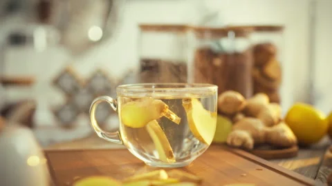 Freshly sliced ginger root spirals in a clear cup unleashing its potent mine Stock Footage 331353781