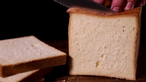 Freshly sliced loaf of bread, made with quality ingredients and baked for Stock Footage 277422752