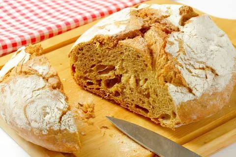 Freshly sliced rustic bread with crusty texture Stock Photos