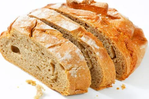 Freshly sliced rustic bread loaf Stockfoto's