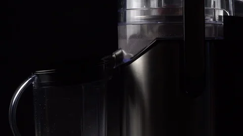 Freshly squeezed apple juice. Squeezing juice with a centrifugal juicer Stock Footage 120698171