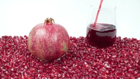 Freshly Squeezed Pomegranate Juice Is A Source Of Vitamins. Stock Footage 263820845