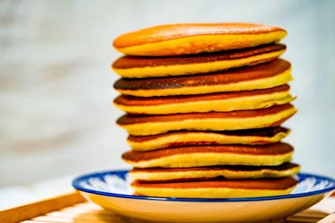 Freshly tasty stack of pancakes on the plate. Delicious homemade breakfast Stock Photos